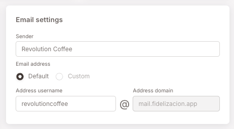 Email settings panel — the Sender display name field (filled with an example brand), the Email address radio set to Default, and the Address username field (an on-brand local-part) combined with the provided address domain "mail.fidelizacion.app".
