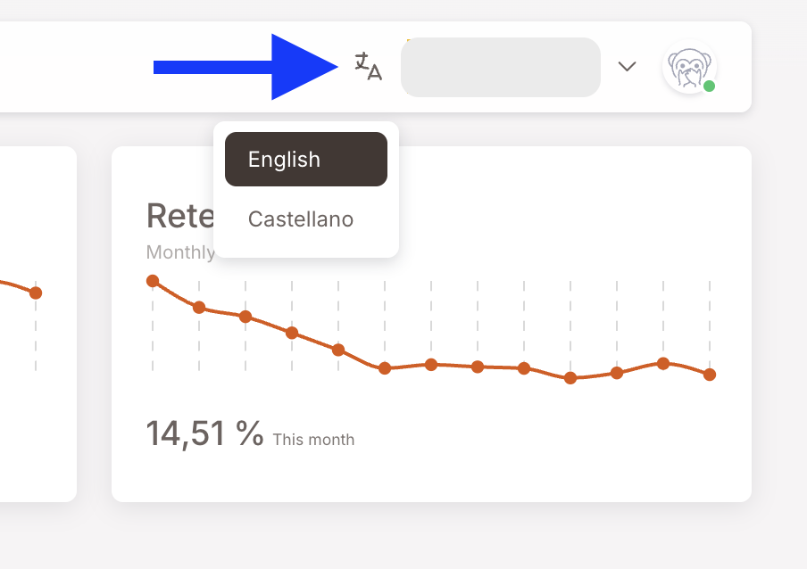 The language switcher dropdown opened next to the translation icon. Two options visible: English (selected, highlighted) and Castellano. A blue arrow in the screenshot points at the translation icon that opens the dropdown.