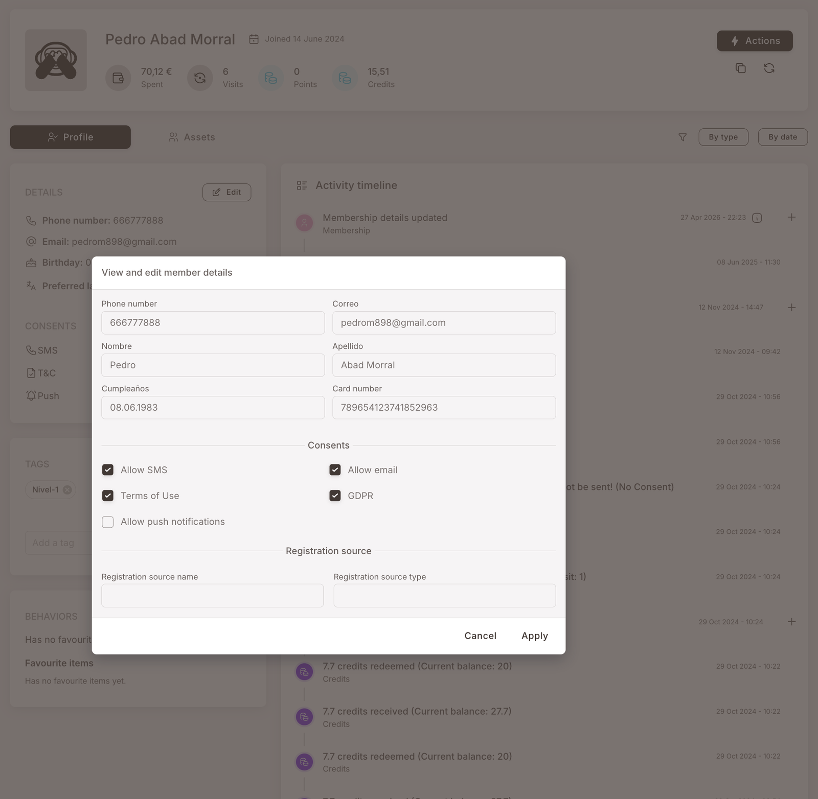 View and edit member details modal opened from a member profile. Fields visible: Phone number, Correo, Nombre, Apellidos, Cumpleaños, Card number, Consents (Allow SMS, Allow email, Terms of Use, GDPR, Allow push notifications — checkboxes), Registration source (name, type). Cancel / Apply buttons at the bottom right.