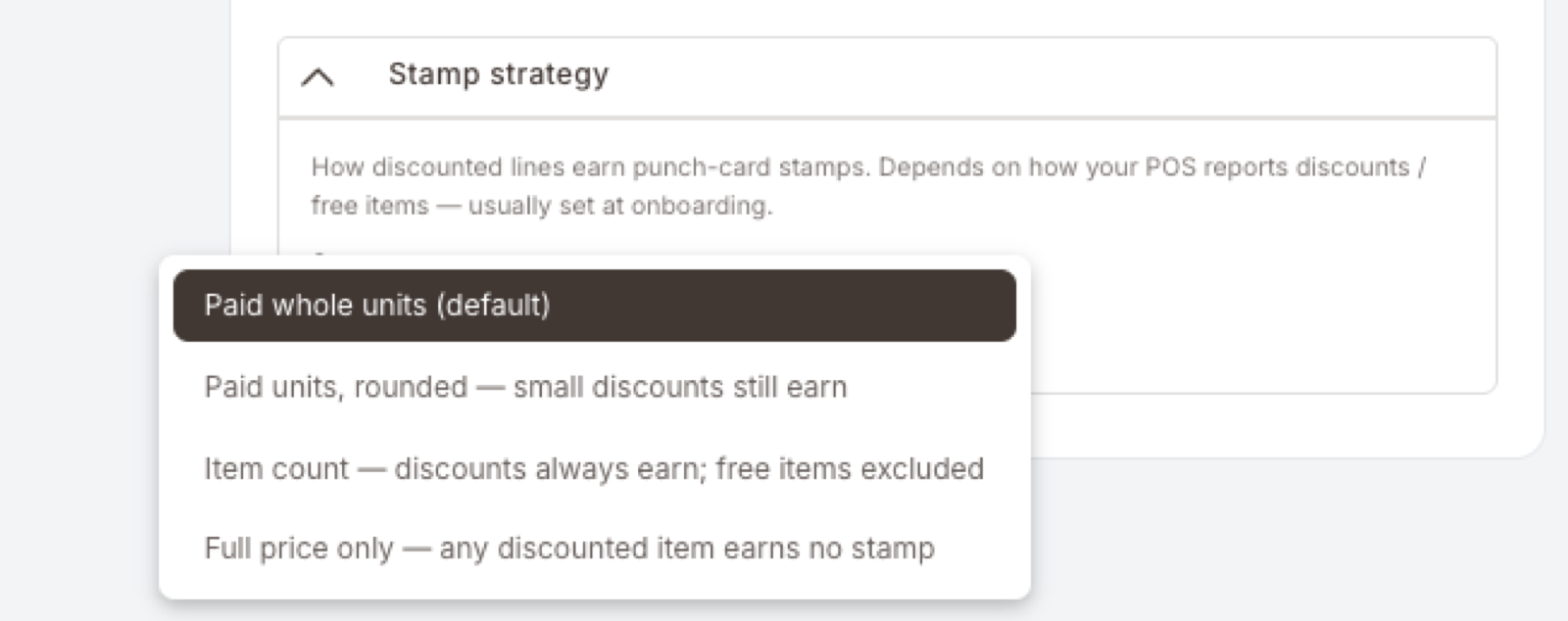 El desplegable Stamp strategy abierto, mostrando las cuatro opciones en orden: Paid whole units (default, resaltada), Paid units rounded — small discounts still earn, Item count — discounts always earn; free items excluded, Full price only — any discounted item earns no stamp.